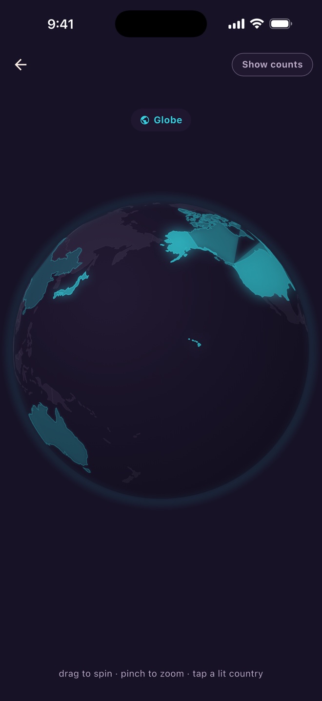 The Coastory globe with visited countries lit in turquoise, including the United States, Canada, Japan, and Australia.
